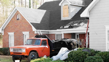 new roof installation on damaged house